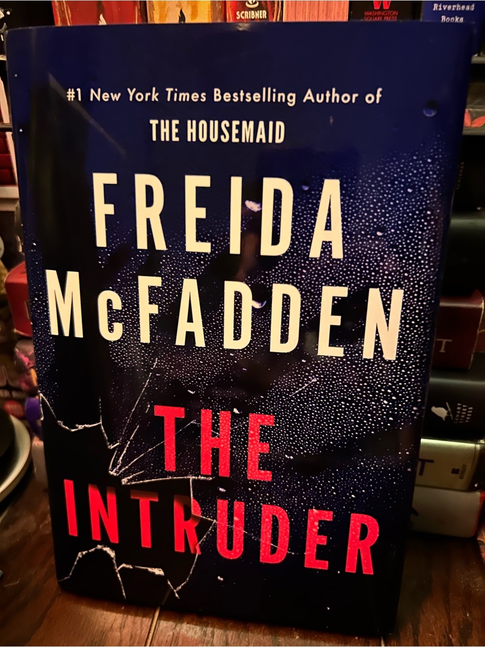 The Intruder Hardcover Book - Navy and Red